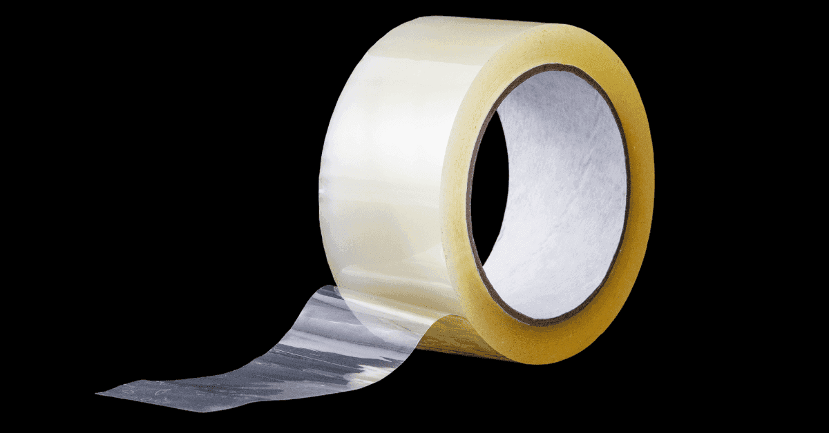Roll of clear plastic shrink film, packing tape, and shrink band spool arranged for packaging use