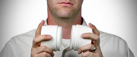 Assorted packaging containers arranged as musical instruments for a bottle band