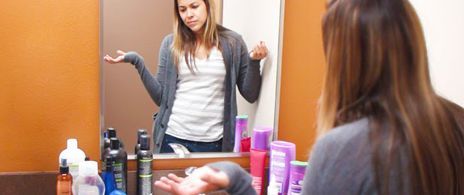 Person with a confused expression, illustrating uncertainty about hair salon product choices